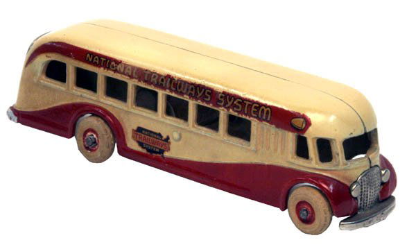 Arcade National Trailways Bus.: 1936 C.I. with w.r.t. and nickel grille and nickel back door. Size: 9 1/4" long. Cond.: Minor decal fatigue to right side yet retains beautiful original patina and decals throughout. A very nice examp