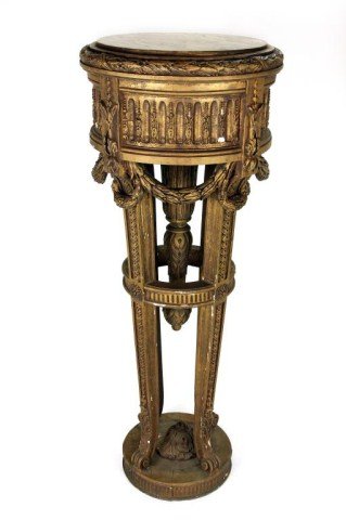 LARGE FRENCH GILT WOOD MARBLE TOP PEDESTAL: H: 45 1 /2 in. (115.5cm), the broad table base encircled with alternating design of raised floral design and hollow ridges above an apron of rope with carved overlapping leaves, cradled by four taperi