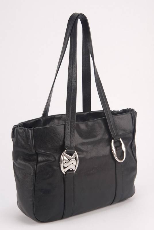 YSL Yves Saint Laurent Black Leather Logo Buckle Bag: Designer: YSL Yves Saint Laurent Style: Tote Bag, Shoulder Bag, Everyday Bag Color: Black Closure: Flap with magnetic button closure Handle: Dual leather handles Hardware: Antique silver tone hardware