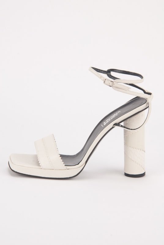 New Gianni Versace Leather Patchwork Heels (10.5/40.5): Designer: Gianni Versace Color: Off White Open toe Barrel heels Lizard, ostrich and crocodile print patchwork leather Adjustable ankle strap Slip resistant out sole Insole: 10.25" / He