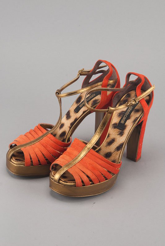 Roberto Cavalli Orange Suede Platform Sandals: Designer: Roberto Cavalli Color: Orange and Gold Strap / Closure: T-strap, adjustable Out-sole: Leather sole Suede body Metallic trim Leather trim Animal print lining Inso