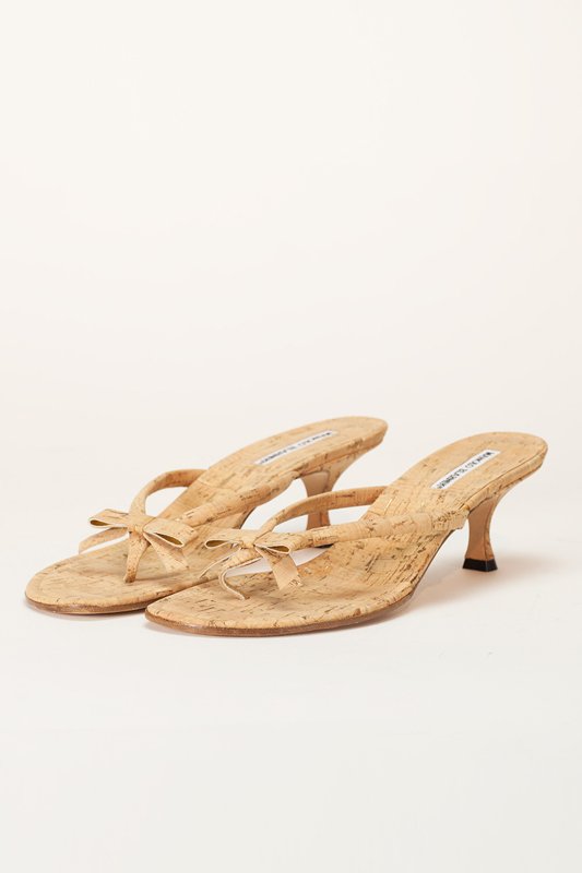 New Manolo Blahnik Tan Cork Thong Sandals (10/40.5): Designer: Manolo Blahnik Color: Tan Out-sole: Leather sole Thong style sandal Cork body Accent cork bow on front Hand made in Italy Insole: 10.25" / Heel: 2.25