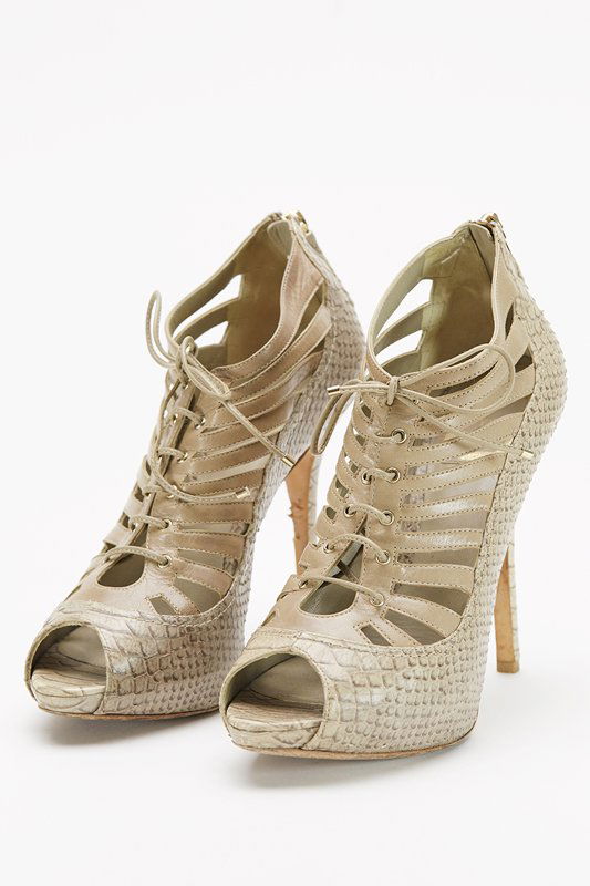 Christian Dior Beige Cage Heels (8/38): Designer: Christian Dior Color: Beige Out-sole: Leather sole Zippered back Gold tone engraved "CD" zipper pull Shoe tie string front Snake printed leather body Leather trim Insole: 9.5" / Heel: 4.5" S