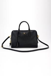 Prada Black Saffiano Signature Leather Bag: **NO BUYERS PREMIUM** Designer: Prada Style: Shoulder Bag, Handbag, Tote Bag, Everyday Bag Color: Black Top zip closure Calfskin leather body Dual rolled leather handles Adjustable leather strap, remo