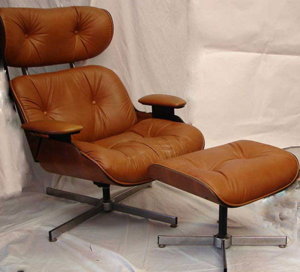 HERMAN MILLER LOUNGE CHAIR & OTTOMAN: Herman Miller lounge chair with ottoman manufactured by Selig. Chair approximately 34" X 50". Ottoman approximately 32" X 18" X 16". Some of the leather is a little worn, overall excellent condition.