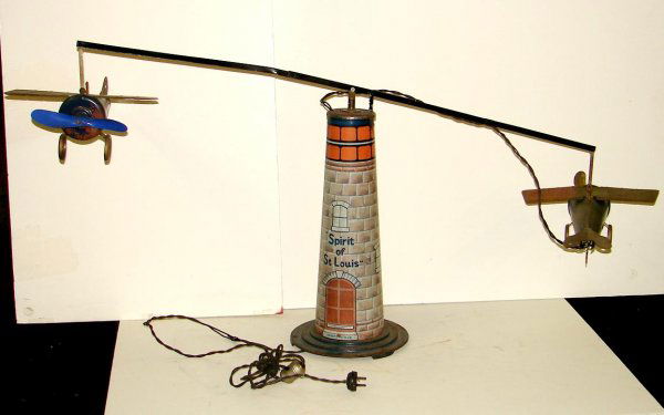 VTG SPIRIT OF ST. LOUIS ELECTRIC POWERED TOY: LOT CONSISTS OF A VINTAGE AND ORIGINAL, ELECTRIC POWERED "SPIRIT OF ST. LOUIS - GO AROUND TOWER" TOY, MADE BY UNITED ELECTRICAL MFG. CO., ADRIAN, MICHIGAN. TOY FEATURES TWO TIN AIRPLANES, BOTH ORIGINA