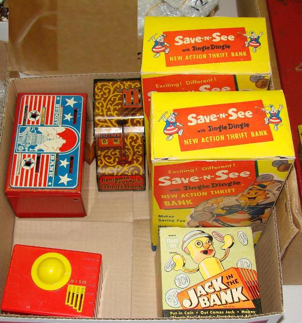 PLASTIC TOY BANK LOT: INCLUDES JACK IN THE BANK WITH ORIGINAL BOX, BUDGET BANK, BENJAMIN FRANKLIN THIRFT BANK, AND (2) SAVE AND SEE BANKS WITH BOXES.