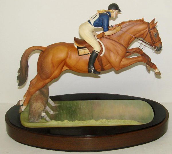 1972 DORIS LINDNER PRINCESS ANNE ON DOUBLET: ORIGINAL ROYAL WORCESTER FIGURINE TITLED "H.R.H. THE PRINCESS ANNE ON DOUBLET" MODELLED BY DORIS LINDER. 1972, EDITION OF 500. MARKED NO. 7. APPROX. 12-1/2" TALL WITH BASE. COMES WITH ORIGINAL WOOD PL