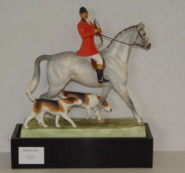 1936 DORIS LINDNER HUNTSMAN AND HOUNDS: ORIGINAL ROYAL WORCESTER FIGURINE TITLED "HUNTSMAN AND HOUNDS", 1936. MODELLED BY DORIS LINDER. UNLIMITED EDITION. MARKED 3115 AND 4815C. COMPLETE WITH WOOD PLINTH BASE. STANDS APPROX. 8-1/4" HIGH. AP