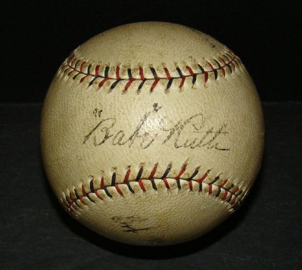 BABE RUTH SIGNED BASEBALL.: PACIFIC COAST LEAGUE OFF WHITE BASEBALL. SIGNED ON SWEET SPOT BY A CLEAR AND STRONG RUTH SIGNATURE, SIGNED ON THE SIDE PANELS BY HARRY WILLIAMSON AND BOB MEUSEL. THIS BALL CAME THROUGH MEUSEL.