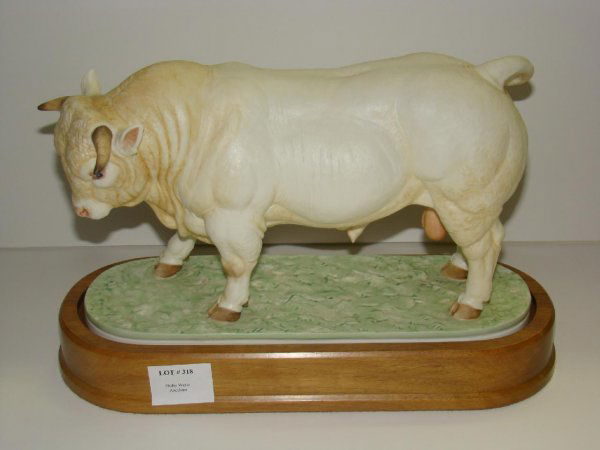1968 DORIS LINDNER. CHAROLAIS BULL: ORIGINAL ROYAL WORCESTER FIGURINE TITLED "CHAROLAIS BULL", 1968, MODELLED BY DORIS LINDER. EDITION OF 500. MARKED "MT". COMPLETE WITH WOOD PLINTH BASE. APPEARS TO BE IN FINE CONDITION. SOLD AS IS.