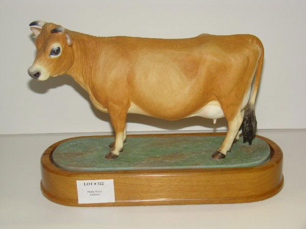 1961 DORIS LINDNER. JERSEY COW: ORIGINAL ROYAL WORCESTER FIGURINE TITLED "JERSEY COW", 1961, MODELLED BY DORIS LINDER. EDITION OF 500. MARKED "0814O OLD". COMPLETE WITH WOOD PLINTH BASE. APPEARS TO BE IN FINE CONDITION. SOLD AS IS.