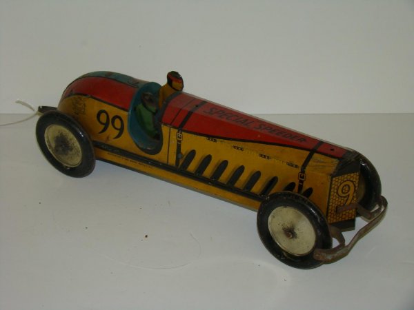 BUFFALO TOYS TIN LITHO CLOCKWORK RACE CAR: 13 1/2" LONG, BUFFALO TOYS TIN LITHO CLOCKWORK "SPECIAL SPEEDER" RACE CAR. MARKED BUFFALO TOY & TOOL WORKS, BUFFALO, N.Y., CAR SHOWS SOME WEAR, ACUFFS, AND SCRATCHES. EXAMINE.