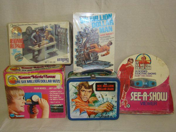 SIX MILLION DOLLAR MAN LOT.: INCLUDES 1978 METAL LUNCHBOX WITH THERMOS, CARDED VIEWER, MINT IN BOX BIONIC BUSTOUT MODEL KIT, BOXED MOVIE VIEWER AND MORE. BOXES TO ALL SHOW SOME WEAR.
