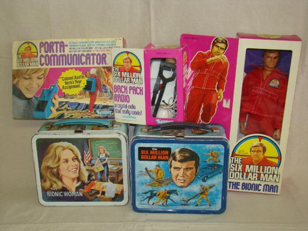 SIX MILLION DOLLAR MAN LOT: INCLUDES METAL LUNCHBOX WITH PLASTIC THERMOS, MINT IN BOX BIONIC MAN, BOXED BACK PACK RADIO, BOXED PORTA COMMUNICATOR, AND METAL BIONIC WOMAN LUNCHBOX WITH THERMOS. BOXES ALL SHOW SOME WEAR WITH SCUFF