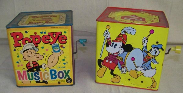 LOT OF TWO VINTAGE JACK-IN- THE- BOX: LOT INCLUDES A WALT DISNEY No.956 WITH MICKEY MOUSE POPPING OUT, AND A MATTEL 1951 POPEYE MUSIC BOX, POPEYE POPPING OUT OF A CAN OF SPINACH. THE MICKEY MOUSE DOES NOT WORK, AND THE POPEYE WORKS.