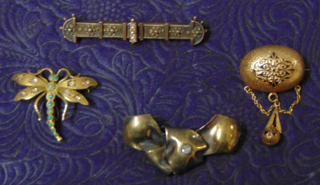 Group of (4) Four Pins, Silver, 14k: A group of four (4) pins. One (1) silver bow brooch 5.1 grams; A 14k dragonfly brooch with turquoise 4.0 grams; a 14k Victorian bar pin with seed pearls 4.0 grams and a Victorian 14k oval enameled dro