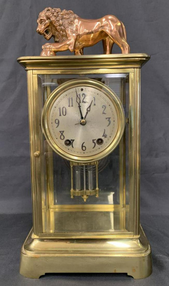 Seth Thomas Crystal Regulator Clock with Lion: "Empire No.13 and Lion", Crystal Regulator Clock by Seth Thomas. Beveled glass panels capped by a mythological lion, with faux-mercury pendulum. Overall approx. 16" high x 7-3/4" x 6". Casing shows we