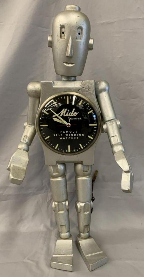 Scarce Electric Mido Advertising Robot Clock: Offered is a Scarce Advertising Display for Mido Self Winding Watches. Manufactured by Copeland Displays, New York, circa 1960's. Approx. 22" tall, with 5-1/2" face dial. Arms can be moved. The head a