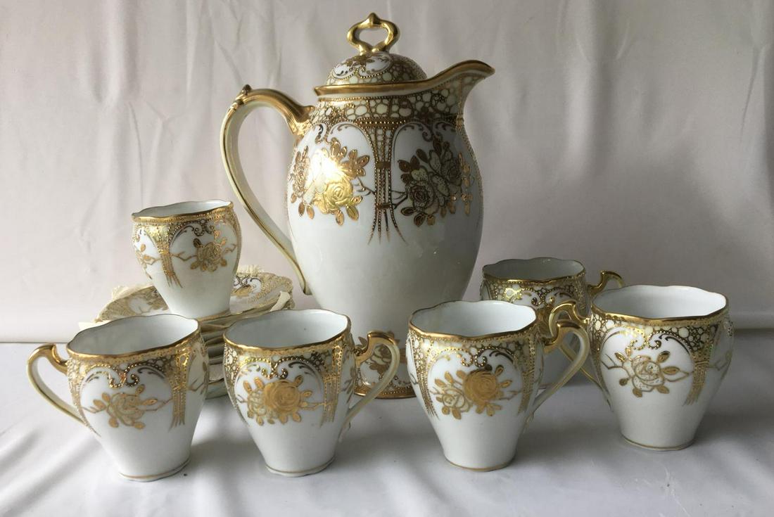Nippon Hot Chocolate Set.: (11) Piece Set. Pot is 9 1/2" tall, (6) cups 3" tall and (6) saucers 5" diameter.