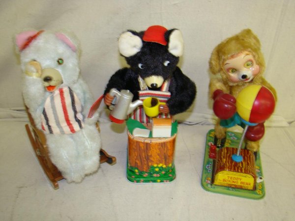 Lot Of 3 Battery Operated Bear Toys Japan: Unboxed. Includes Teddy the Boxing Bear (Yonezawa), Coffee Pouring Bear, and Makeup Bear (Modern Toys). Each made in Japan, and each shows some signs of playwear. Battery compartments are clean. Toys