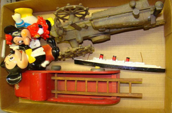 Assorted Toy Lot: includes Mickey Mouse, Minnie Mouse, and Donald Duck coin banks, Buddy L wood fire truck, cast iron John Deere tractor. Sold as is.