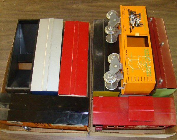 Lot of TCA Wide Gauge Trains: 9 pieces. All show some edge and corner wear. Sold as is.