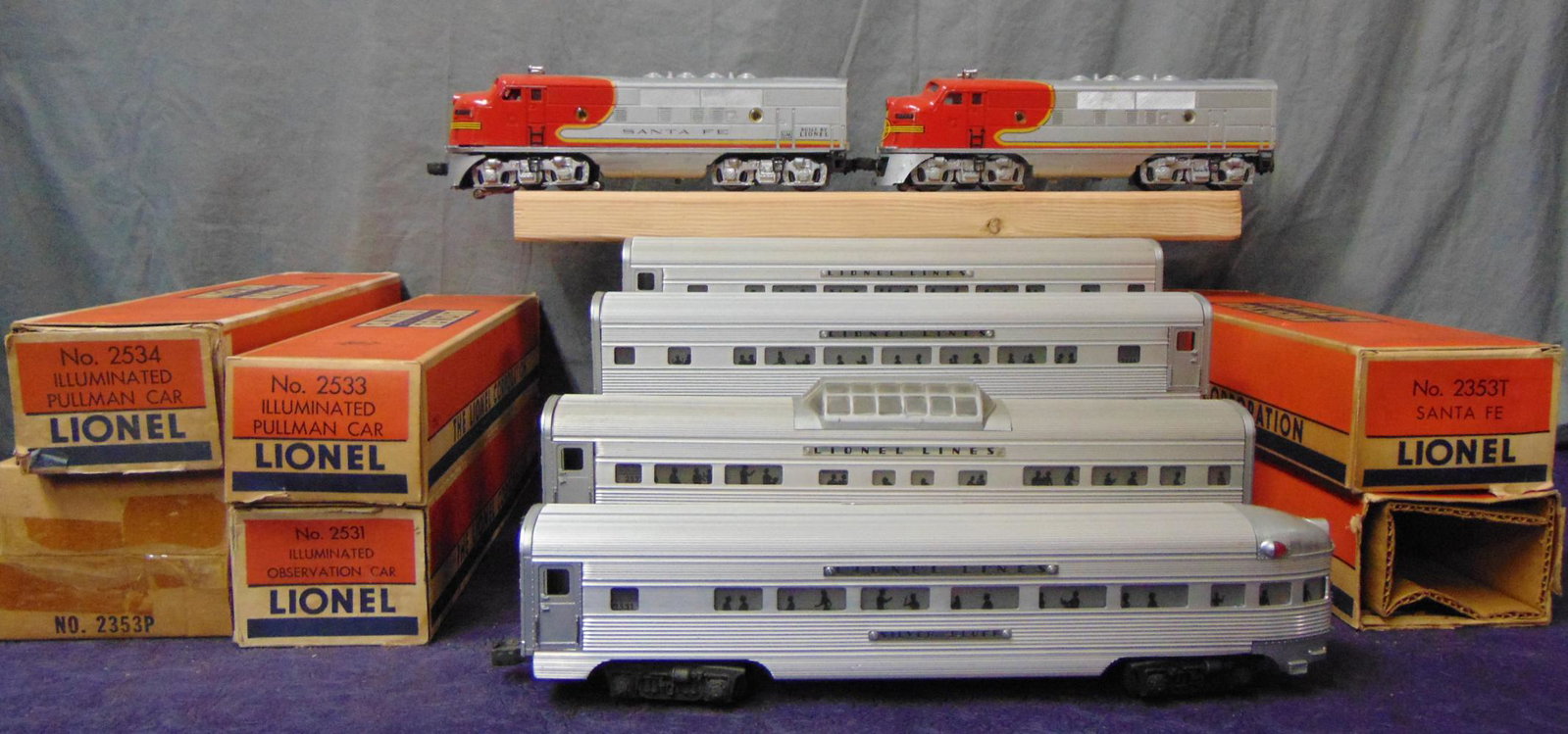 Boxed Lionel Super Speedliner Set: Includes a 2353 SF F3 AA Diesels. Clean with bright silver, usual nose decal wear at doors, but has a clean battery box; 2532 Vista-dome; 2533 & 2534 Pullmans; 2531 observation. All are clean and show