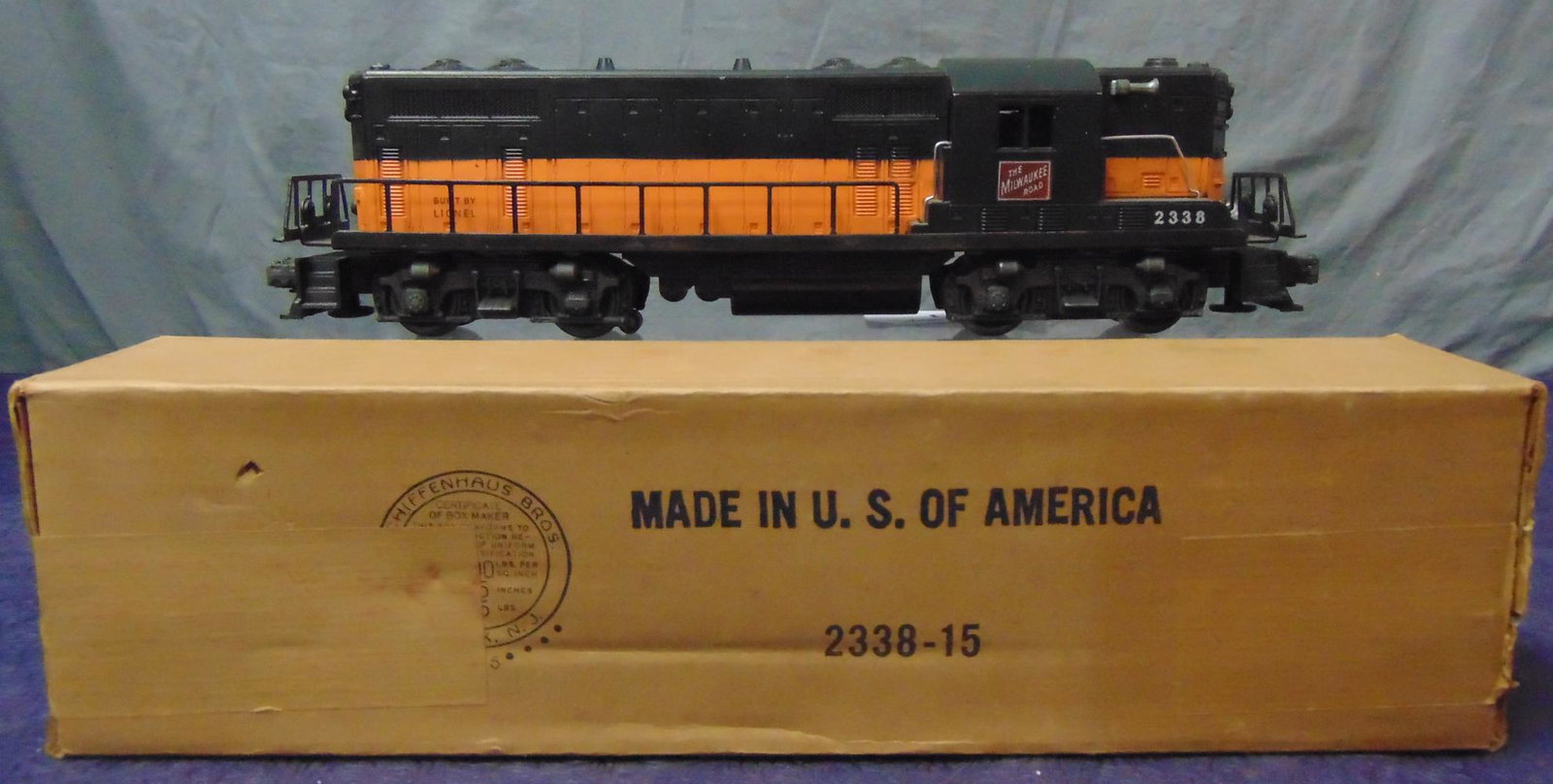 Boxed Lionel 2338 MR GP7 Diesel: Last variation with black & orange painted on orange mold. It has a clean battery box and shows light runtime with nice box. From The Estate Collection of Neil Padron.