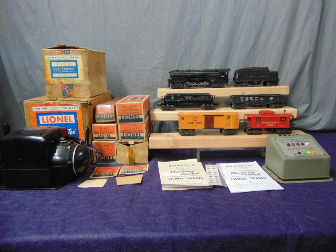 Lionel Sears Electronic Set: Includes a 671R turbine, nicely restored; 4671W tender; 4652 gondola with drums, decals flaked off; 4454 BR boxcar; 5469 coal dump; 4372 caboose. ECU & instructions worn, VW transformer. Rest show lig