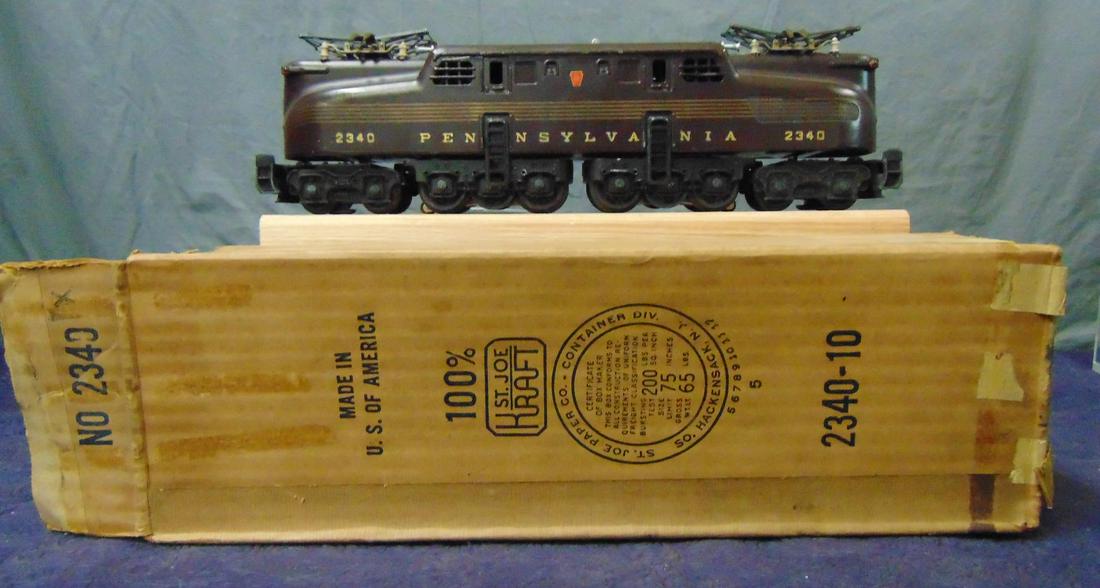 Nice Boxed Lionel 2340 Congressional GG1: Very nice 2340 dual motor GG1, 1955. It is tuscan, 5-stripped with 95% stripes. It is clean and bright with instructions. It shows light runtime with box. Nice example! From The Estate Collection of N