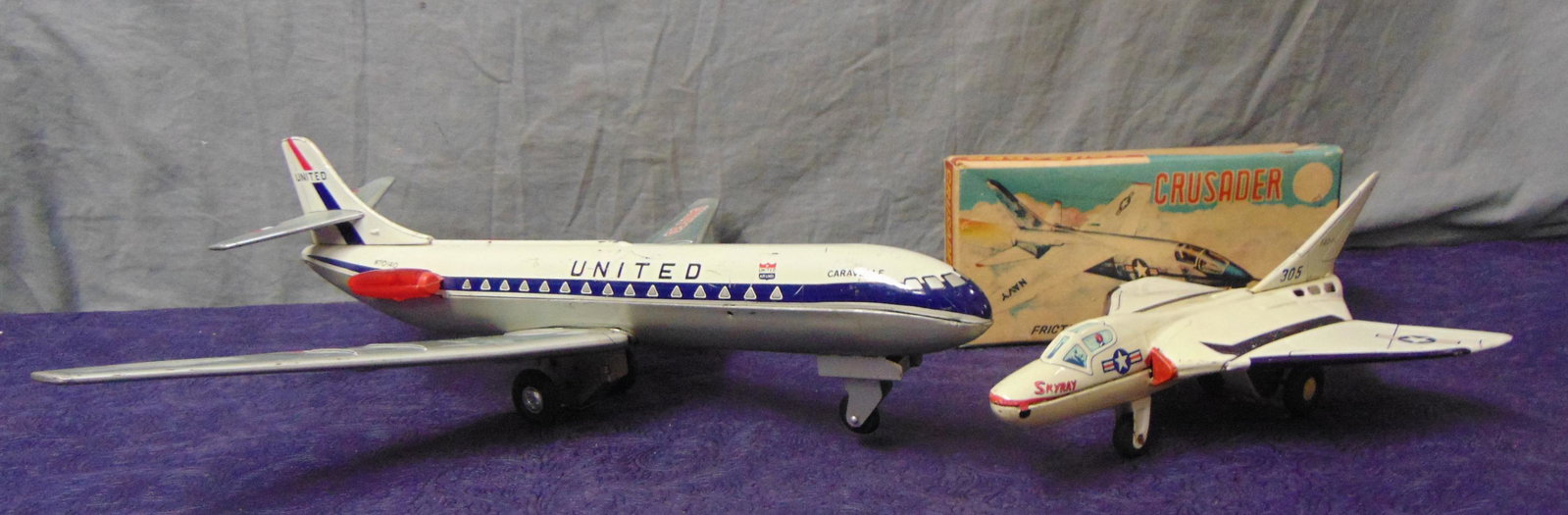 2 Japanese Jet Planes: Includes a Boxed Yone Japan Crusader jet showing light use; Alps United Caravelle, battery op, 17” WS, smoke operated from engines, but no motion when tested. Shows light to moderate use.