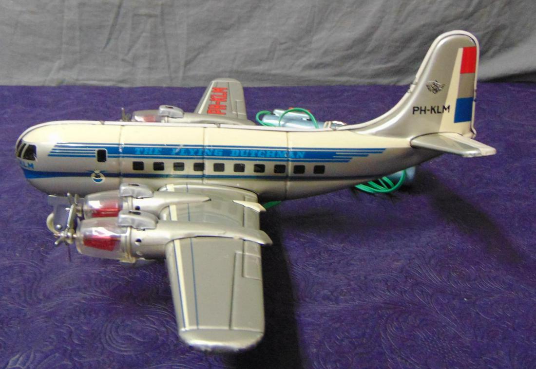 Boxed Marx KLM Propeller Airplane: Unusual litho tin plane for KLM, 14” WS. It is battery powered with lighted engines, prop action and forward motion with turning. All functions worked at time of test, clean tether control box. It s