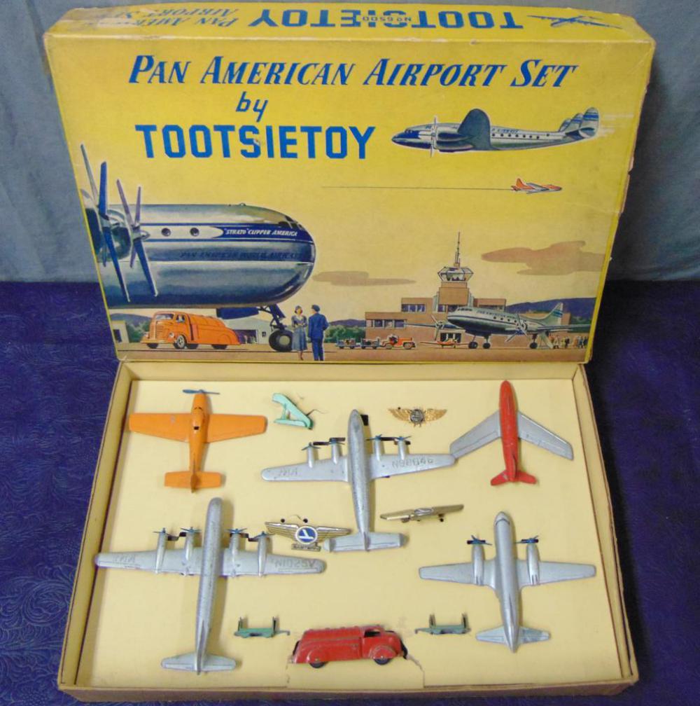 Boxed TootsieToy 6500 Pan Am Airport Set: Nice 12pc set with aircraft, baggage set, lapel pins and more. They are intact and show light playwear with display inert and clean set box, 2 split corners.