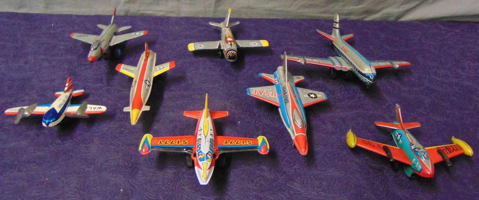Assorted Tin Japanese Toy Planes: All litho tin with rubber wheels, most friction drive. Makers include Ashi, S2, Marx, Yone & others. Largest is 7.5” long. Most show light playwear.