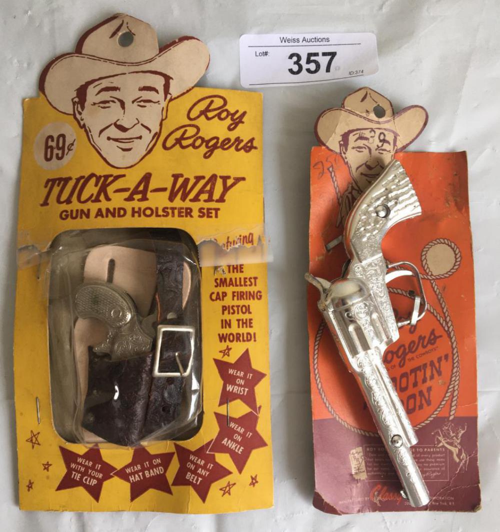 Lot of Two Card Roy Rogers Cap Guns.: Includes Tucka-way Gun and Holster Set and Shootin Iron. Both on the original cards. Tuck-A-Way set card has been tape repaired.