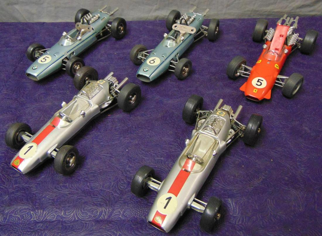 5 Schuco Grande Prix Racers: Includes 2 #1072 BMW Formula 2 #5 & #6; 2 #1071 Lotus Formula 1, one missing motor cover; 1073 Ferrari Formula 2, missing 1 faring upright. All functioned at time of test with 2 keys.