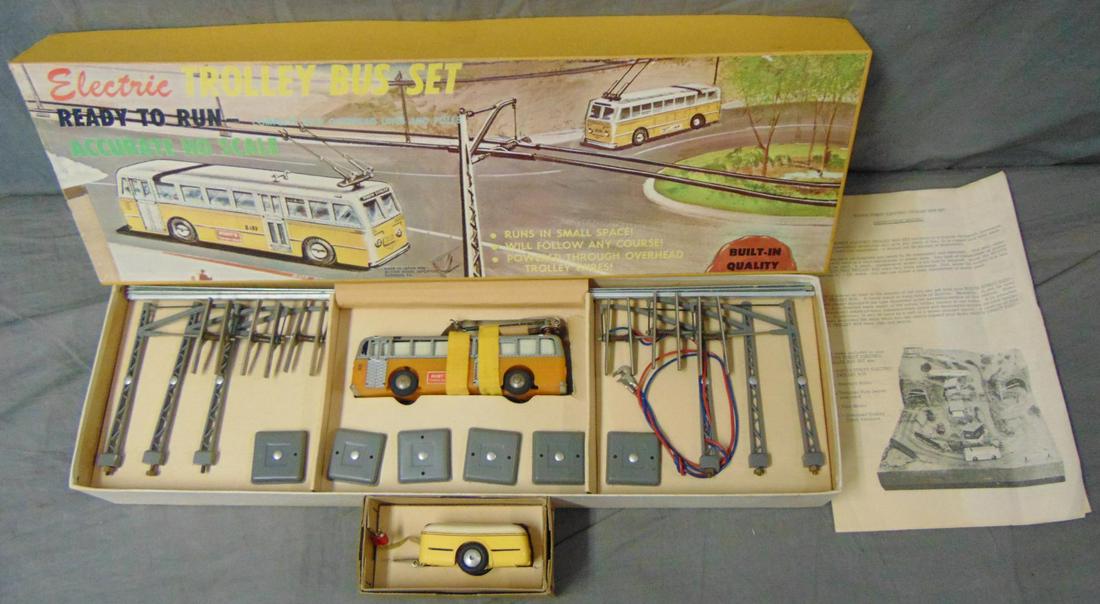 Boxed Eheim Electric Trolley Set: Actually and electric bus, this nice set was made for HO gauge trains, but goes better with O/S. It is electric powered and appears new in box, plus includes a Battery trailer, used where no electrici