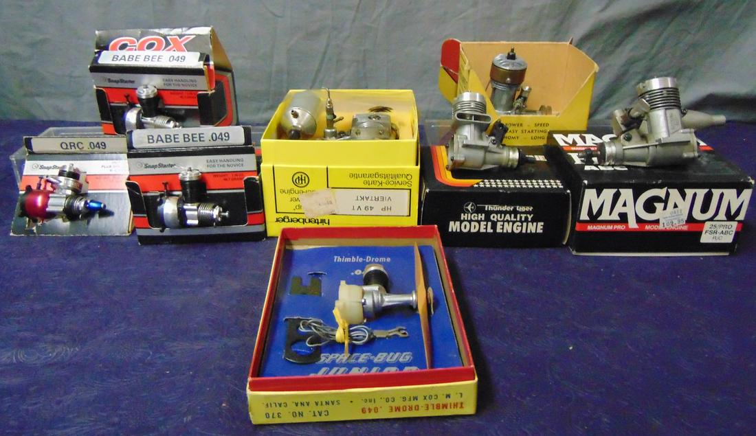 7 Boxed Gas Model Airplane Engines: Includes a Hittenberger HP 49VT with gas tank; Forster 29RCW with addition parts; Thunder Tiger 20III RC; Magnum Pro 25/PRO FSR-ABC; 2 Cox .049s; Thimble Drome Space Bug Junior. All sold AS-IS.