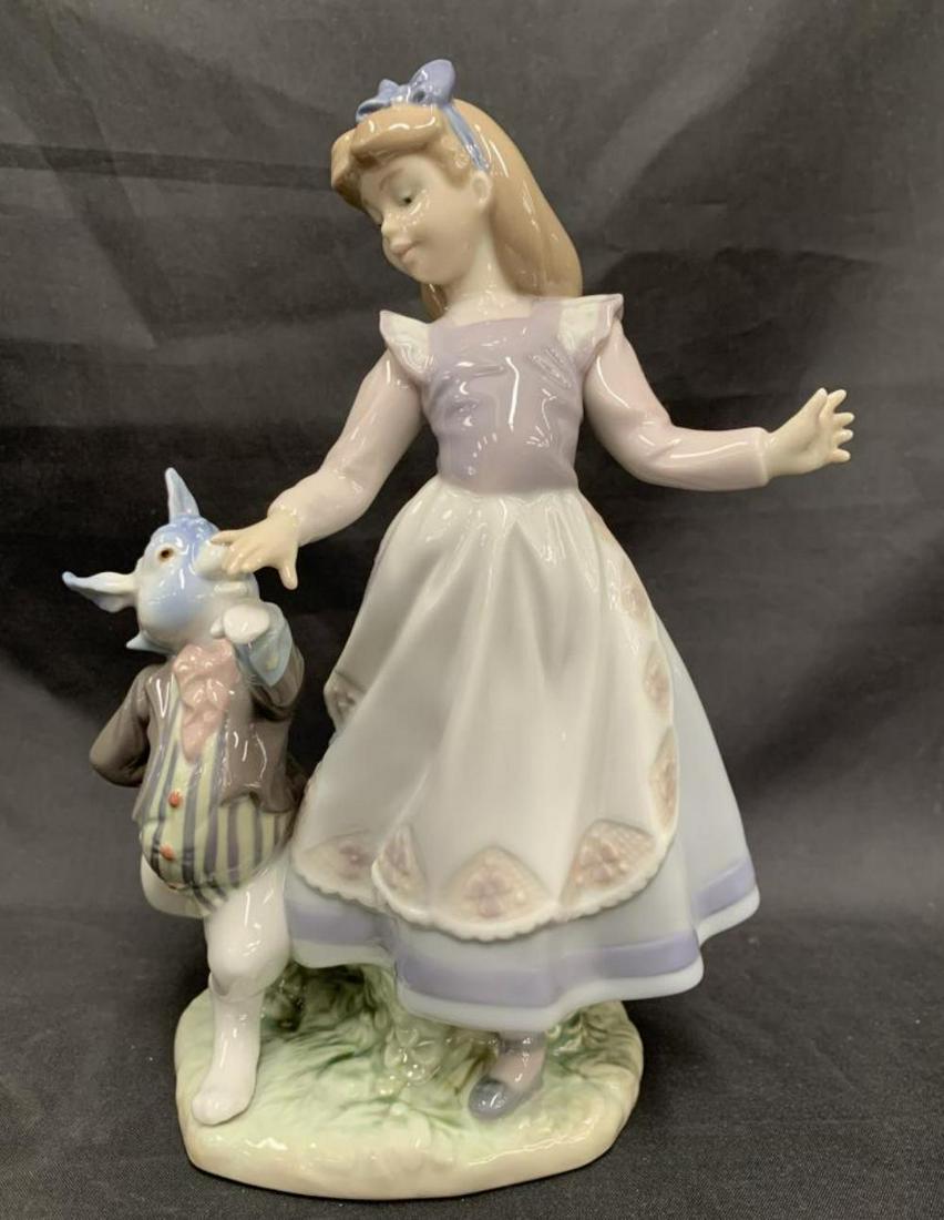 Lladro Alice in Wonderland Figurine #5740: Alice with Rabbit, #5740. Approx. 9" tall. Comes in the original box.