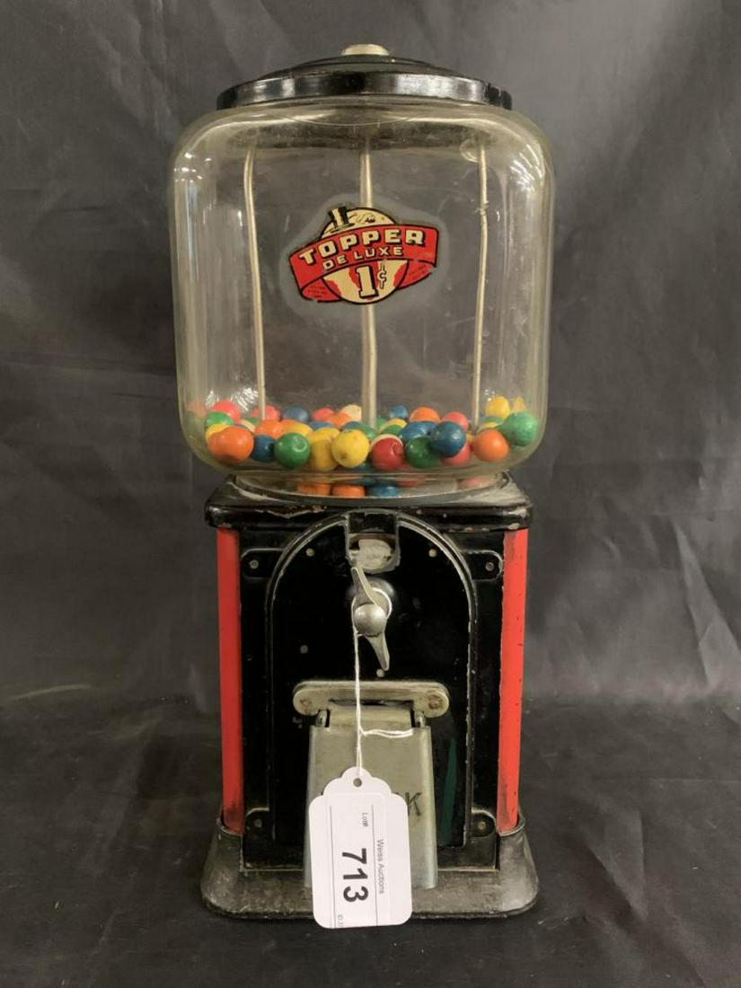 1 Cent Topper Deluxe Coin Operated Gumball Machine: Working condition. Approx. 16-1/2" tall. No key. Back of glass globe has an interior crack. Paint scuffs and scratches throughout. See images.