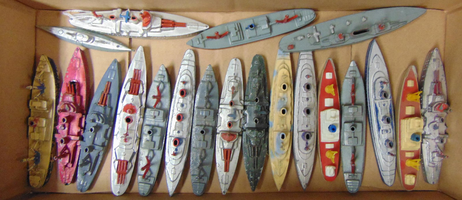 20 TootsieToy Ships: Assorted styles and ages. All are intact, may be missing a few wheels. Paint condition is over-all nice.