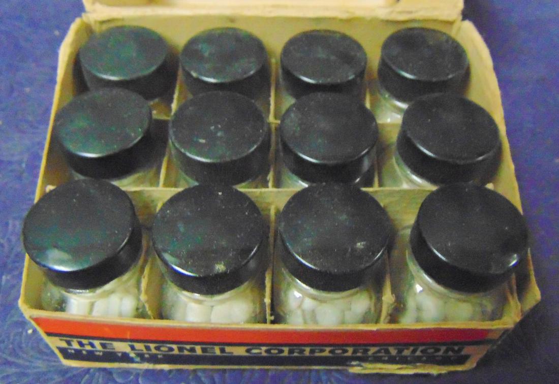 Nice Lionel SP Pellet Store Display: Includes 12 rubber-stamped bottles full. They appear matched and like new with insert and nice display box. From The Estate Collection of Neil Padron.