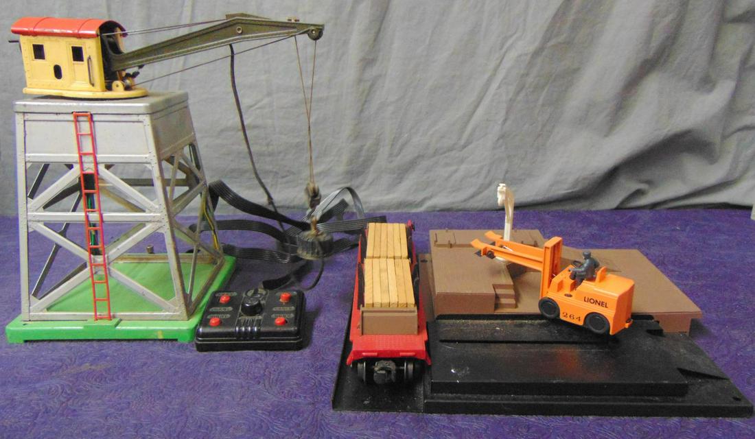 Lionel 165 & 364 Accessories: Includes a 165 Magnetic crane, controller rewired, magnet has replaced loop; 364 Forklift Platform with late 6264 flat with Timken trucks. Has replaced crane, only missing 5pc of lumber. Both are fair