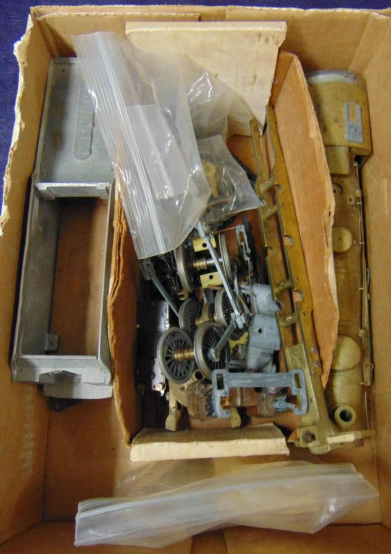 Cast Bronze O Scale Steam Loco Kit: Many parts are included with most major components apparent. Looks like 6 drivers, pony wheels have 4 & 6 wheels?? Tender appears to be diecast. All that is included is photoed, so examine carefully. 