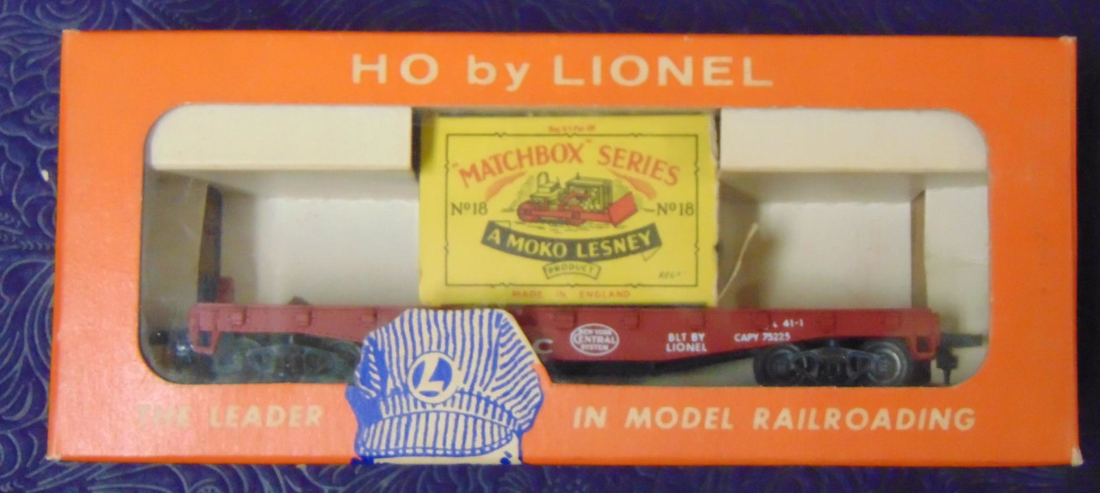Boxed Lionel HO 0807-1 with Matchbox Dozer: Lesney And Lionel Collaborated on a few early HO Cars. This NYC flat includes a Moko #18A Dozer with dry and crumbling treads. The Matchbox is missing 1 end flap, car shows light use with insert and n