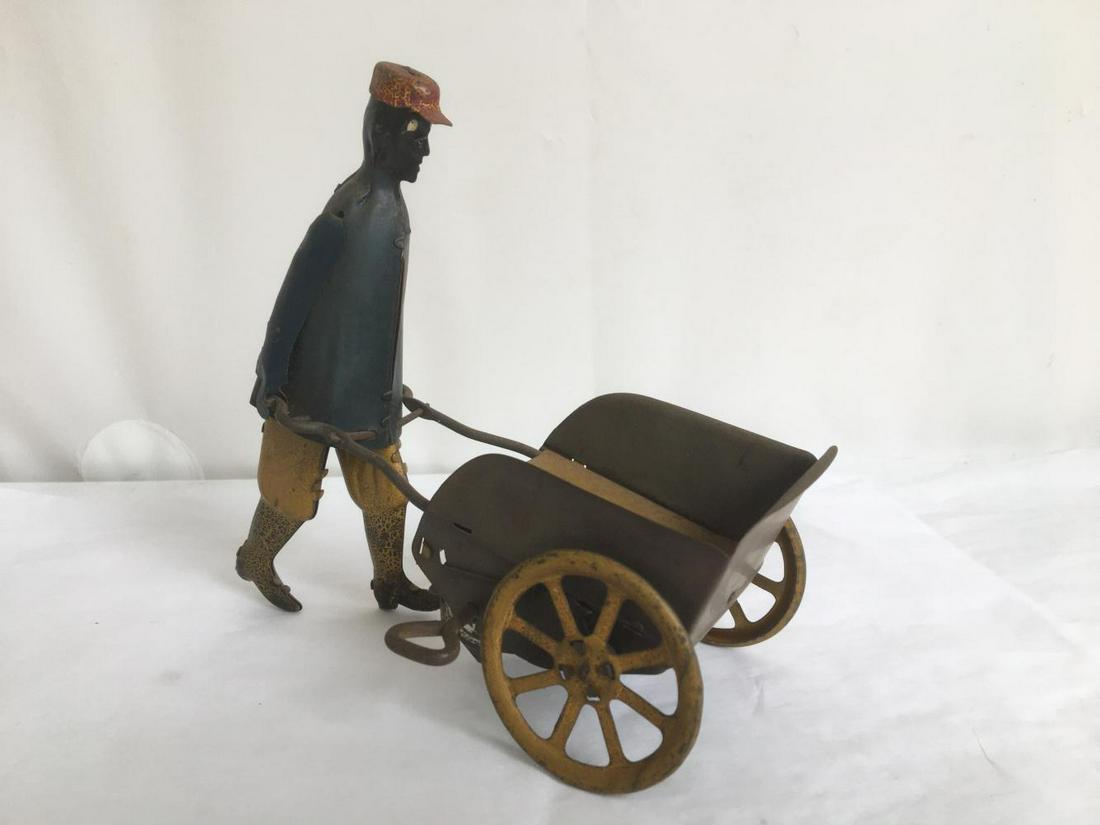 German Wind Up Tin Porter and Cart. (1 of 4)