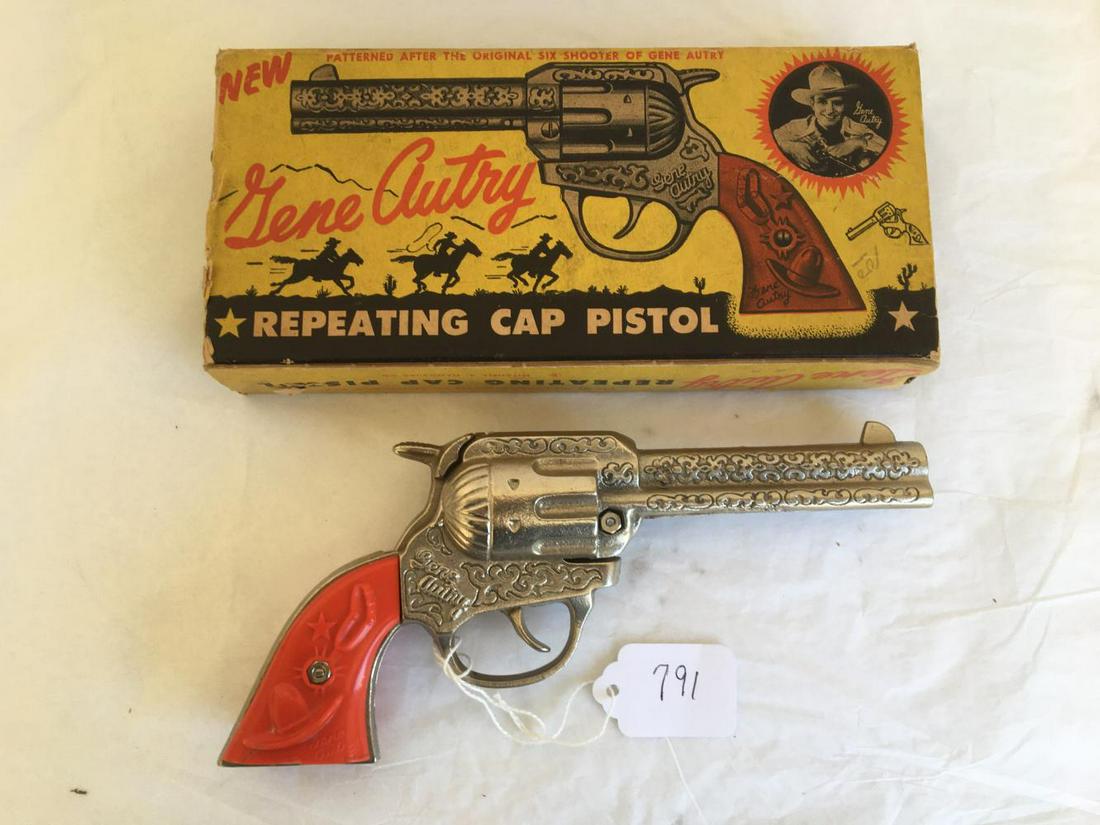 Gene Autry Cap Pistol Boxed.: Kenton Cap Pistol. Box is worn with end flaps off. Gun is in Excellent condition.