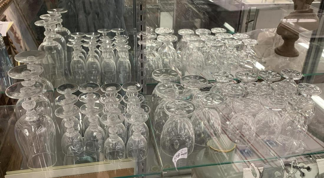 Lalique Barware. Lot of 33 Crystal Glasses: includes assorted styles. All signed lalique. Small chip noted to two pieces. Scratched noted to bottoms. No other chips or cracks noted. Examine photos for styles and bid accordingly