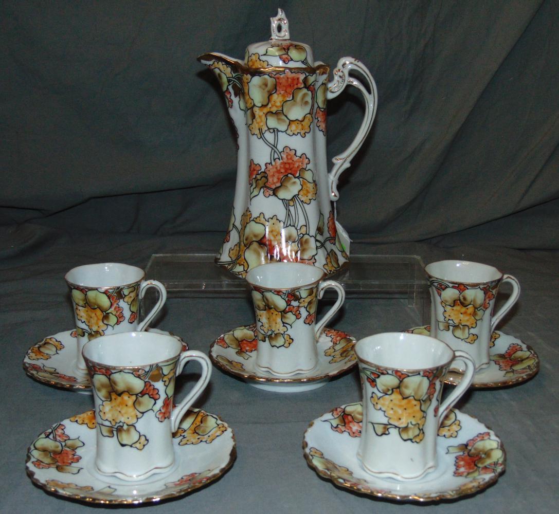 Beautiful Nippon Chocolate Set.: 11 Piece set includes Chocolate Pot, (5) Cups and (5) Saucers Pot is 9 1/2" tall, dishes 5" across and cups are 3" tall.